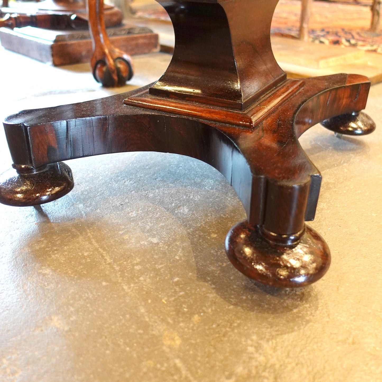 Bun feet on an antique gaming table from the 19th century