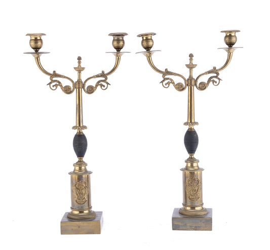 A distinctive pair of 19th century Empire Style Gilt Metal candlesticks