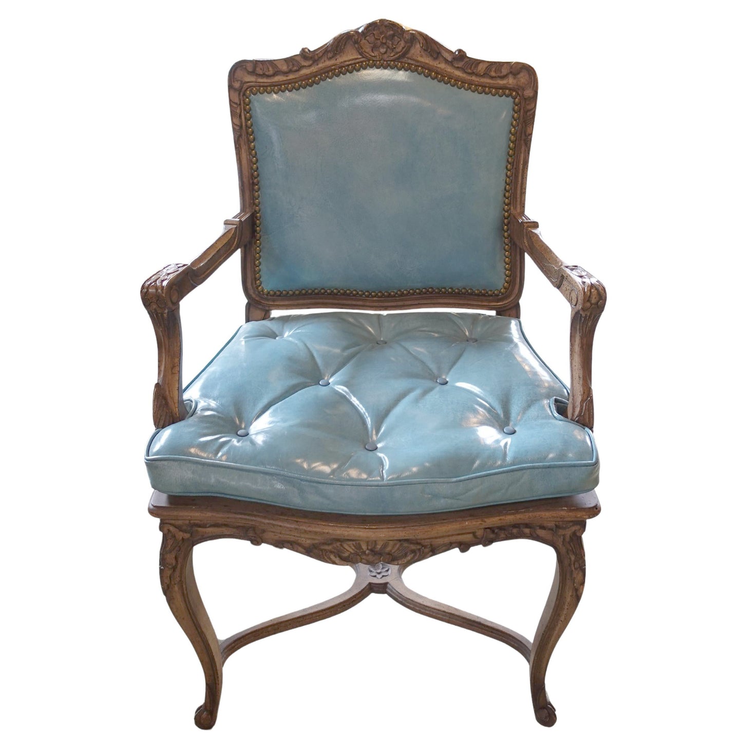 Vintage chair with light blue cushioned seat and backrest on a white background