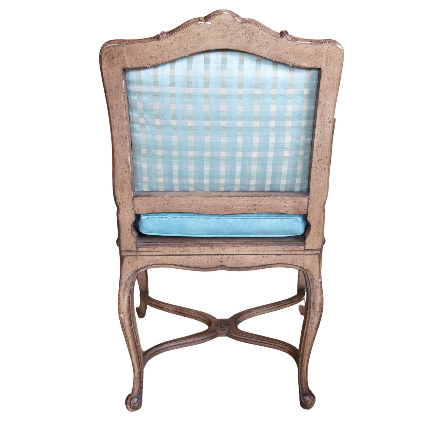 Chair with wooden frame and blue checkered cushion on a white background