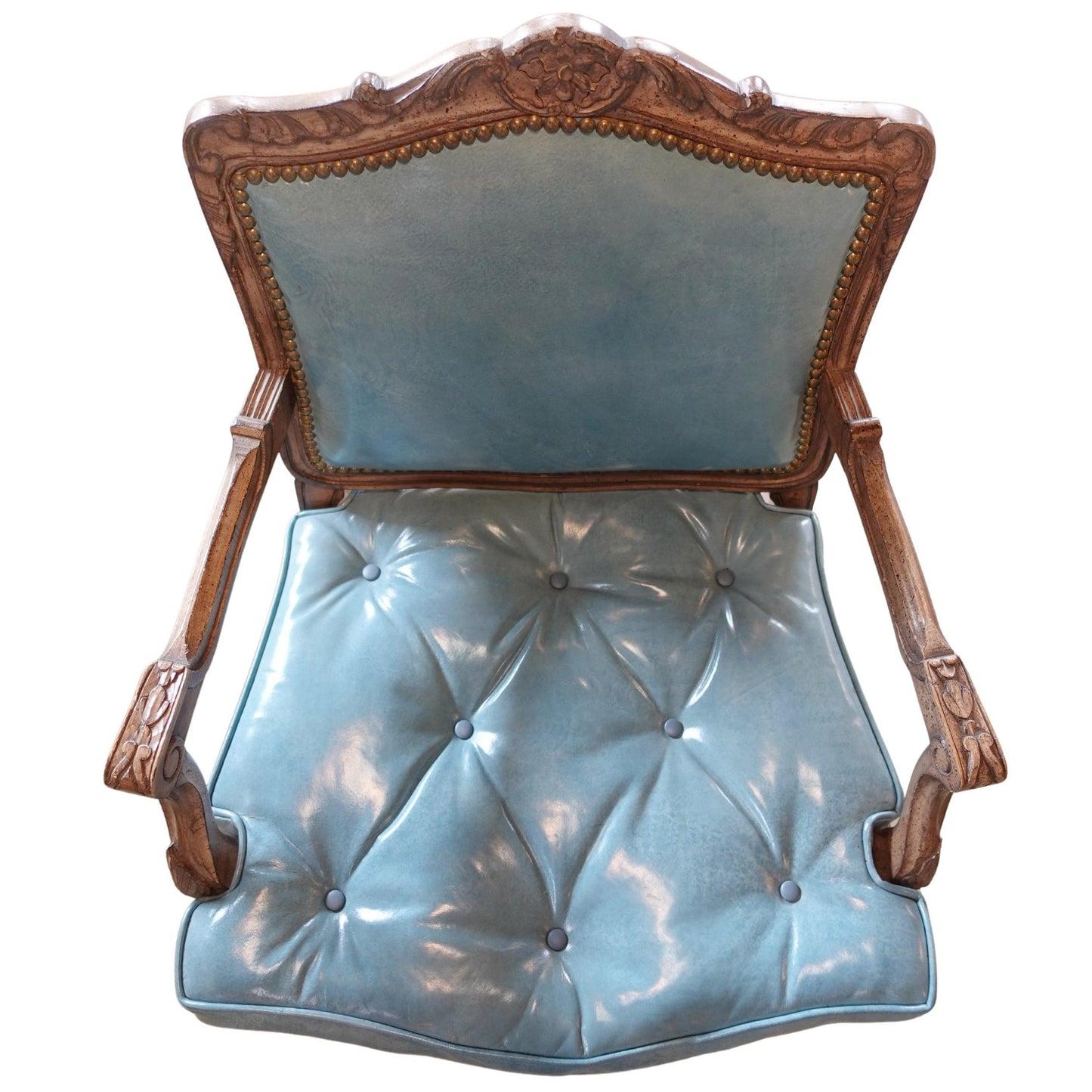 Chair with wooden frame and light blue naugahyde cushion on a white background