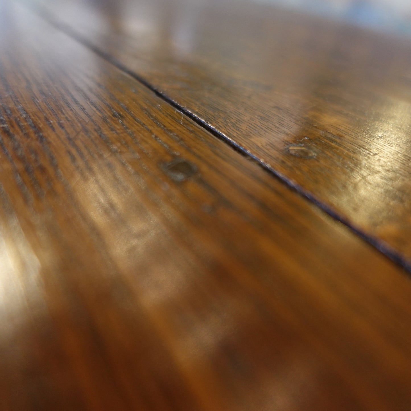 Close-up of a wooden surface with visible grain and texture
