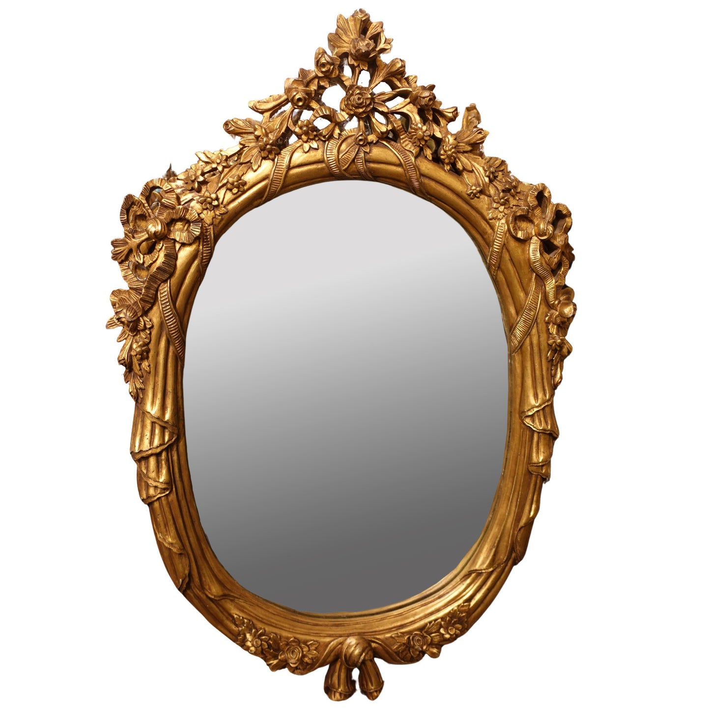 Decorative gold mirror with intricate floral designs on a white background