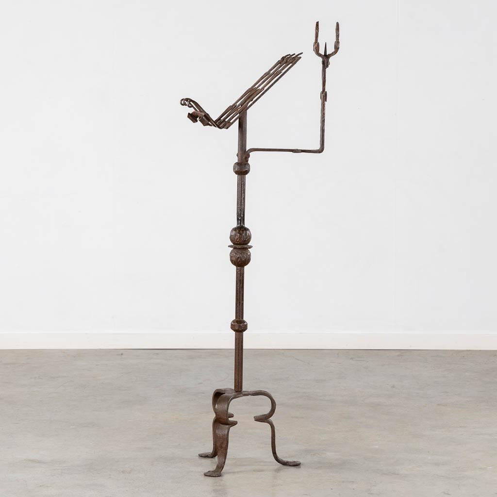 An impressive Gothic Revival wrought iron Lectern or Music stand with articulated candle mount