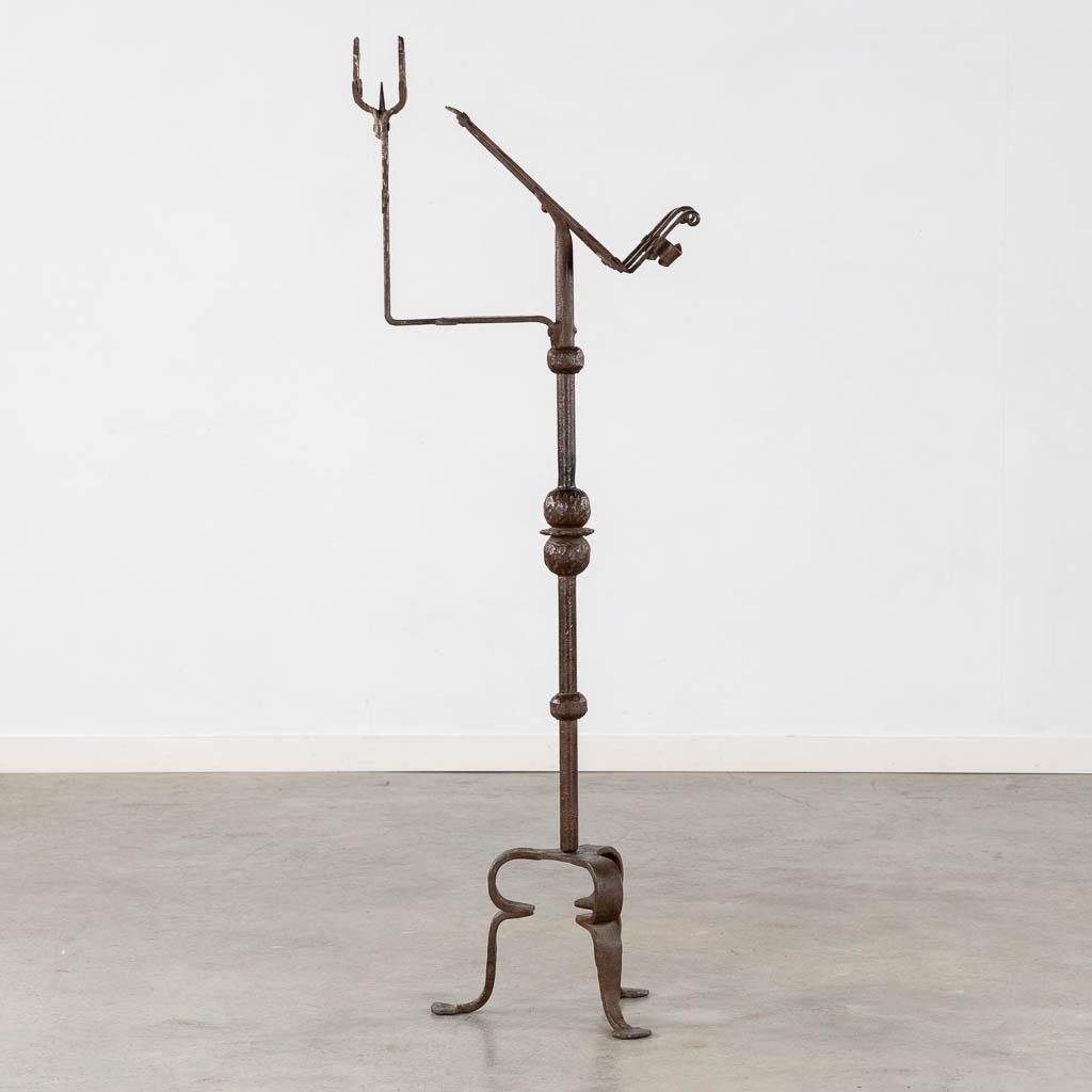 An impressive Gothic Revival wrought iron Lectern or Music stand with articulated candle mount