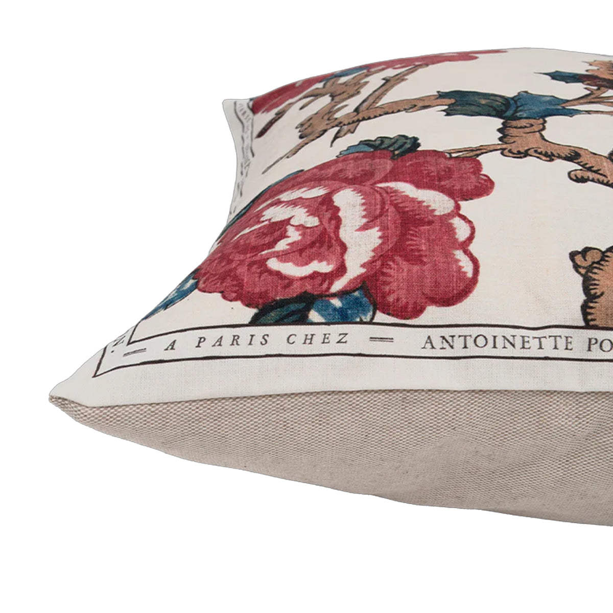 Decorative pillow with floral design and text on a beige background