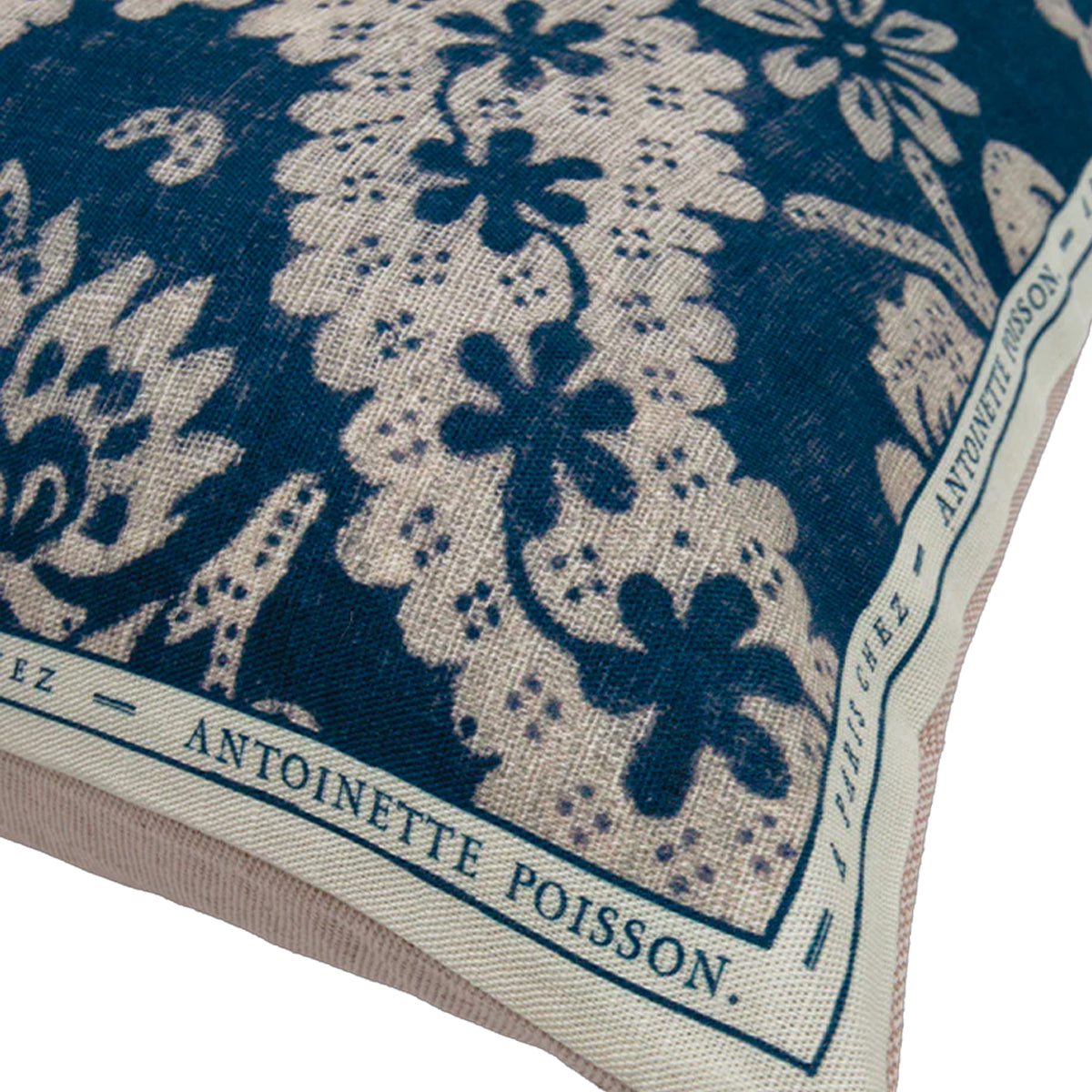 Close-up of a fabric with floral patterns and 'Antoinette Poisson' branding.