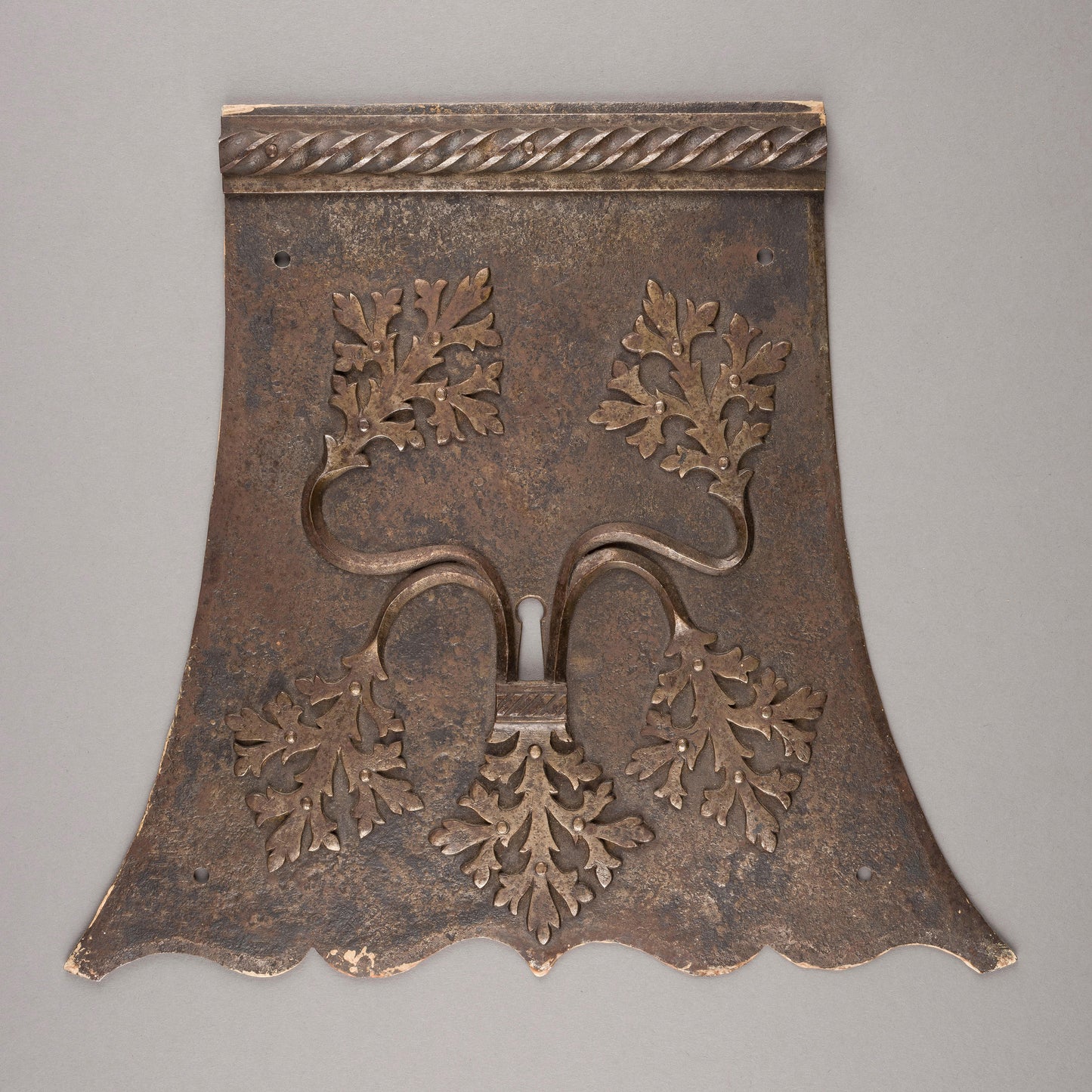 Antique European Iron Forged Lock Plate appropriated as wall art with an exquisite Acanthi pattern in relief