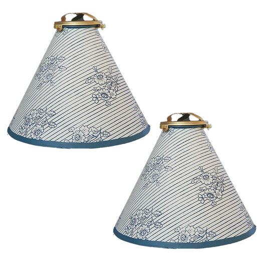 Two cone-shaped lampshades with floral patterns on a white background
